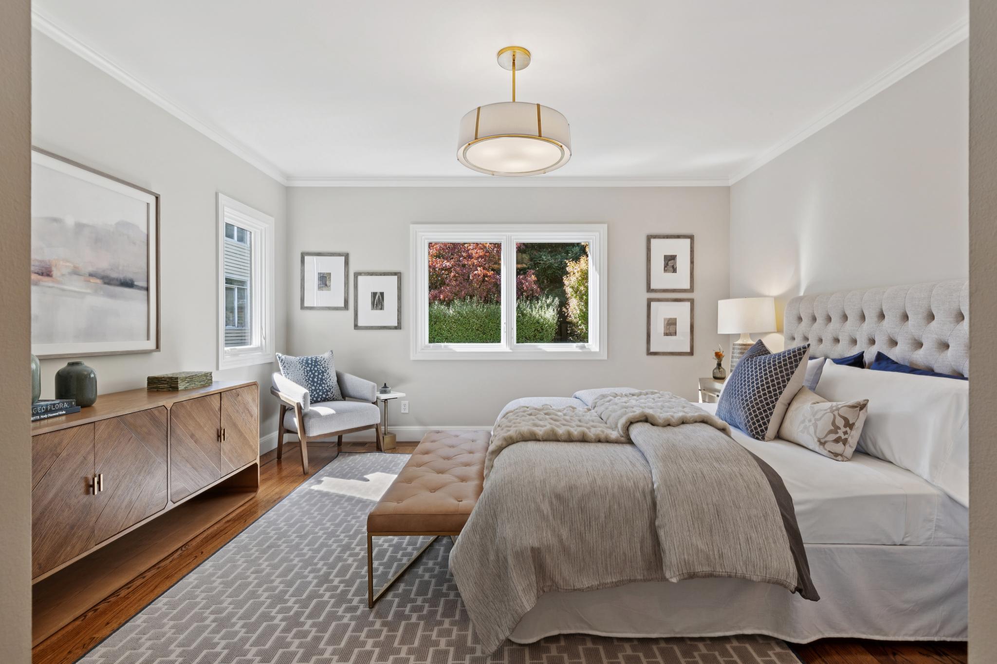 Primary bedroom overlooking the private yard