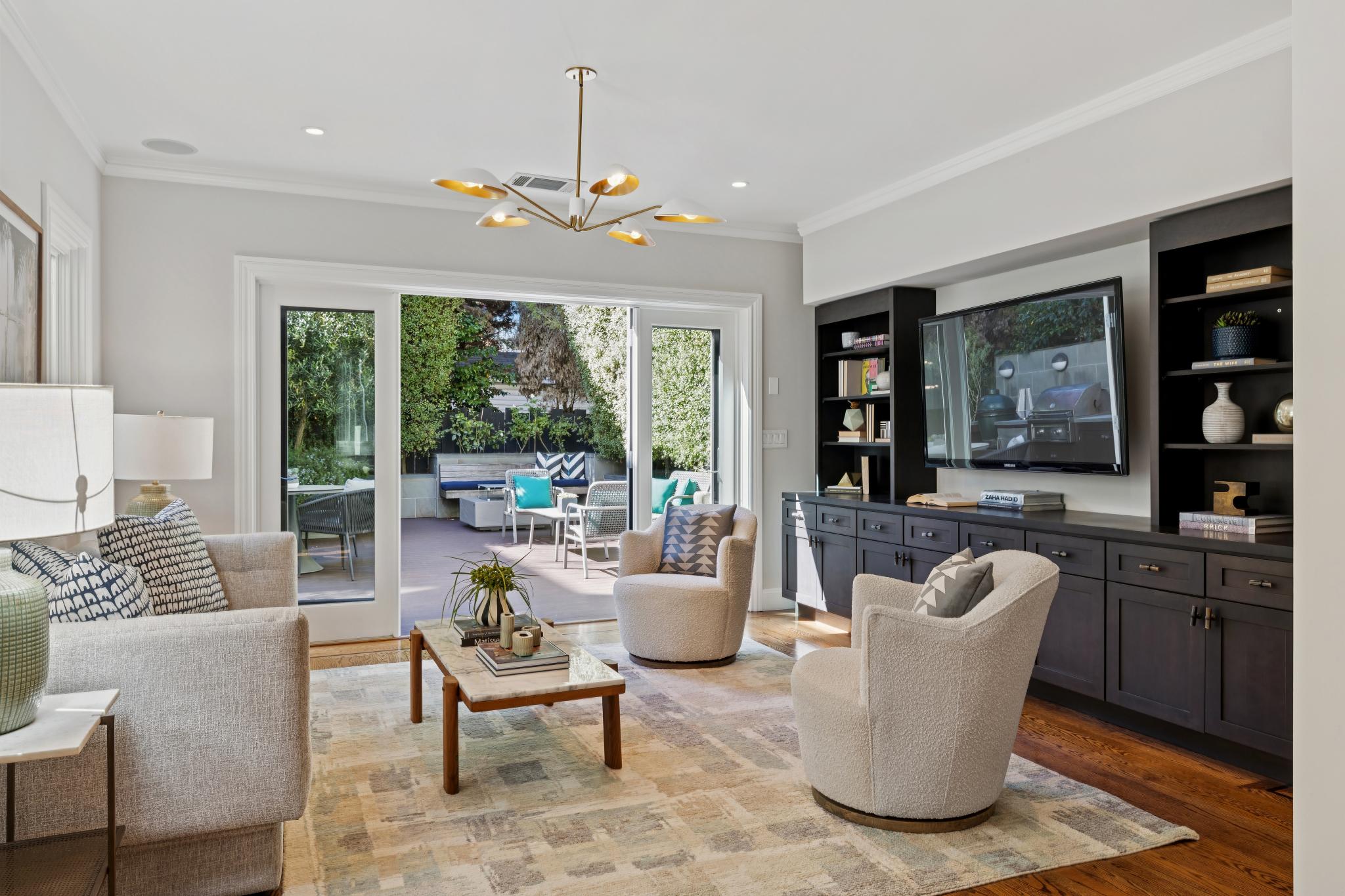 Family room with built-in entertainment center and French doors